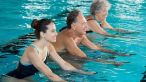 Adults participating in low-impact water workouts for strength and longevity